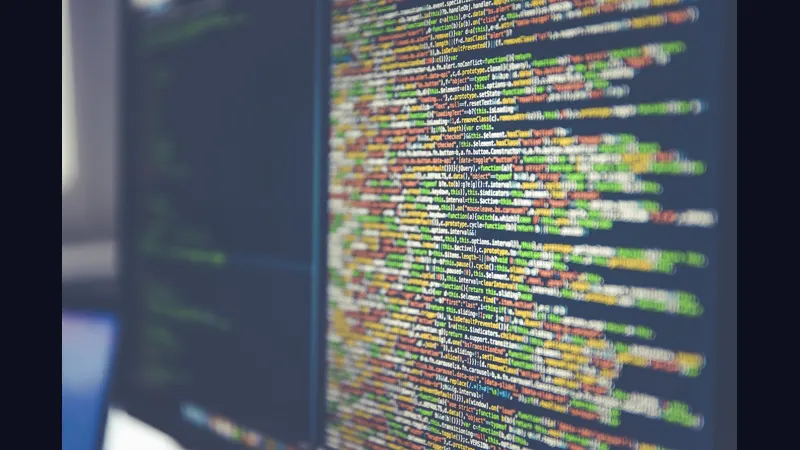Open source code and a play button on a dark screen